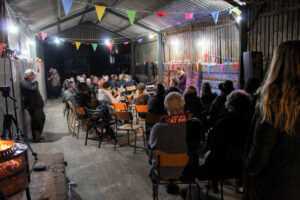 Group of people watching music in the barn
